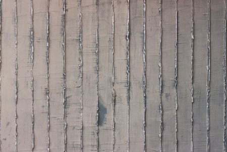 Gray concrete wall background texture with vertical stripesの写真素材