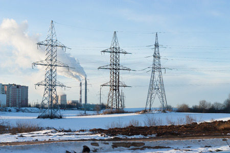 Electricity pylons and wires in winterの写真素材