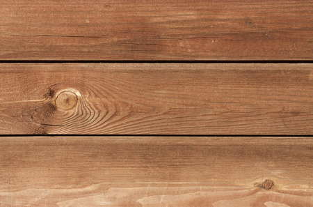 Three brown treated pine wood plank overlapped horizontal.の写真素材