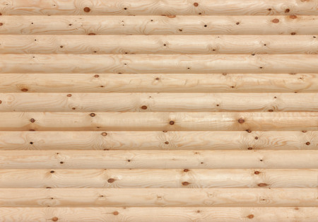 New round wooden logs wall natural background texture.の写真素材