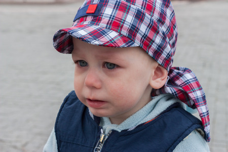One and a half year old upset angry little boy child crying aloneの写真素材