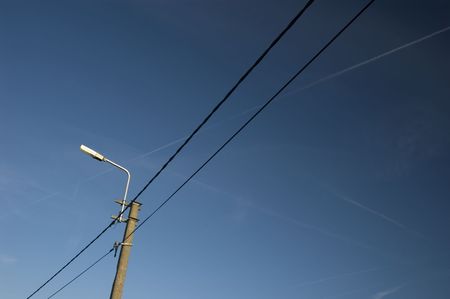 streetlight and wires, isolated on blue backdropの写真素材