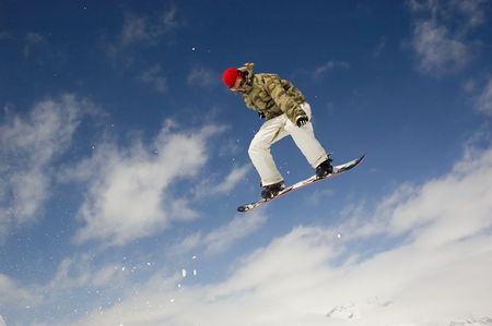 snowboarder jumping high in the air