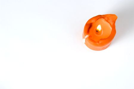 topview of an orange lit candleの写真素材