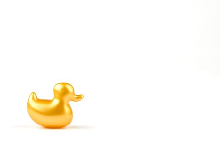bath soap in the shape of a yellow duck, isolated on white backgroundの写真素材