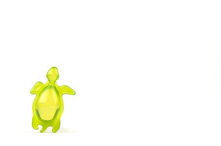 bath soap in the shape of a green tortoise, isolated on white backgroundの写真素材