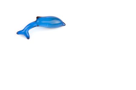 bath soap in the shape of a blue dolphin, isolated on white backgroundの写真素材