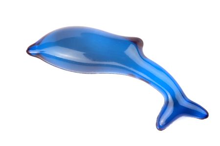 bath soap in the shape of a blue dolphin, isolated on white backgroundの写真素材