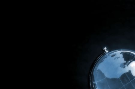 blue hazy globe isolated on black backgroundの写真素材