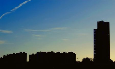 skyline silhouette against blue sky with some cloudsの写真素材