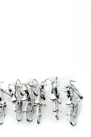 a row of bikes covered in snowの写真素材