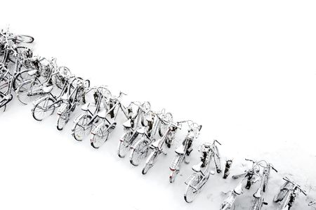 a row of bikes covered in snowの写真素材