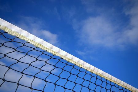 white tennis net under blue clouded sky の写真素材