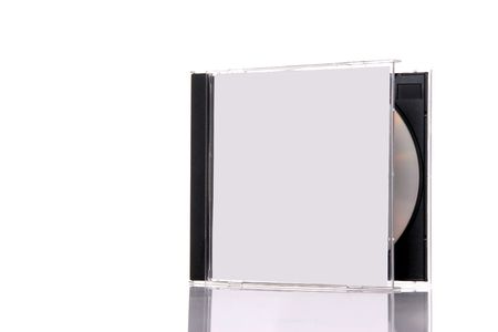 a compact disc in the box, isolated on white background with reflection. Almost closed boxの写真素材
