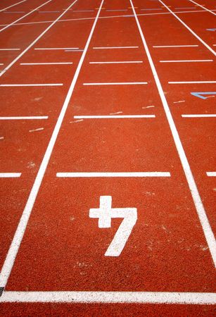 number four of a racetrack, on red tarmac, for runners. Leading linesの写真素材