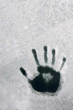 handprint isolated in snow with copyspaceの写真素材