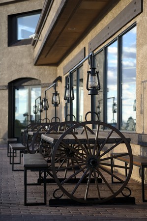 Clouds and oil lamps are reflected in tavern windows in a sunsetの写真素材