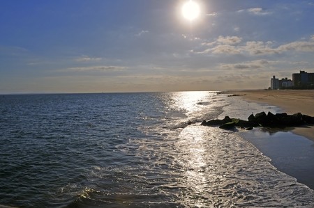 Evening sunset ashore ocean. Waves wash a bankの写真素材