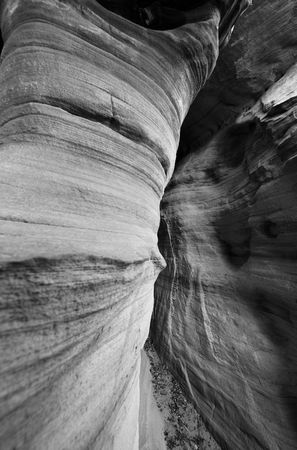 Inside a small sandstone slot created by the forces of wind and water, Zion National Park, Utah, USAの写真素材