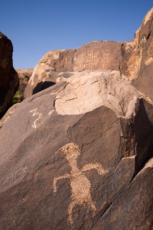 Petroglyphs carved onto rock surface by prehistoric Native American(s) at Anasazi Canyon, Utah, USAの写真素材