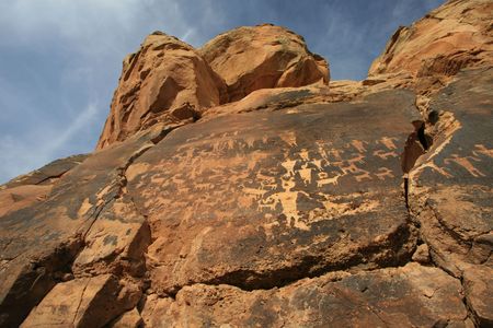 Wide angle view of panel of petroglyphs carved onto rock surface by prehsitoric Native American(s) in southern Utah desert, USA.の写真素材
