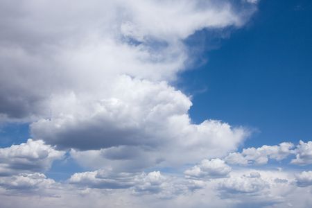 View of blue sky and clouds on summer day.の写真素材