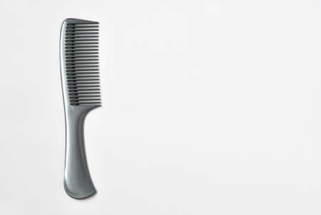Hairdressing supplies, accessories, comb, gray brush, gray backgroundの写真素材