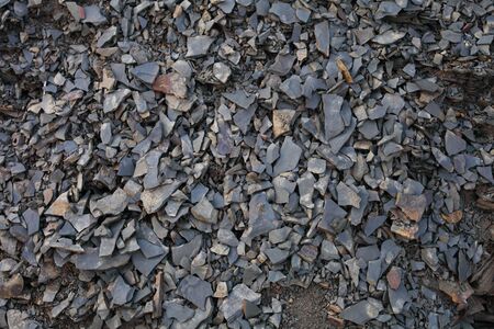 small natural pebbles crumbled from a cliff, background texture