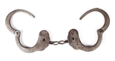 police handcuffs on a white background, isolate, close-upの写真素材