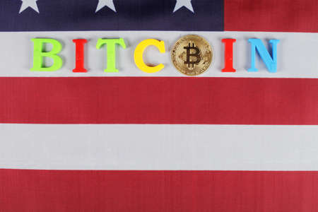Golden bitcoin, inscription bitcoin on the flag of the United States, place for your text, selective focus, top wievの写真素材