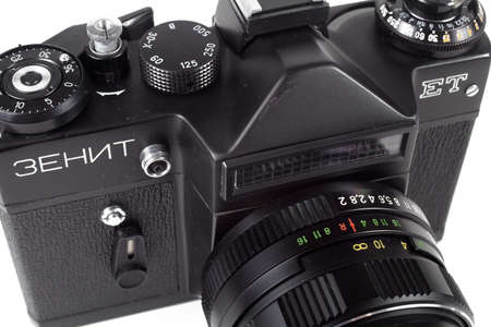 old SLR camera on a white background, isolate, written in Russian Zenith ET