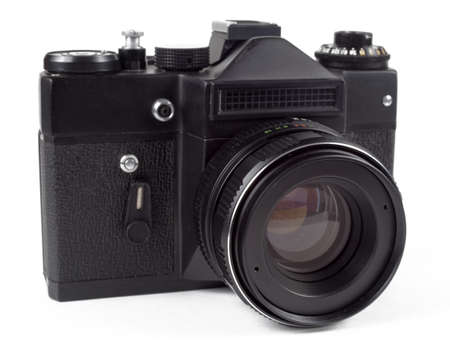 Old film SLR camera, white background, isolate, selective focus.