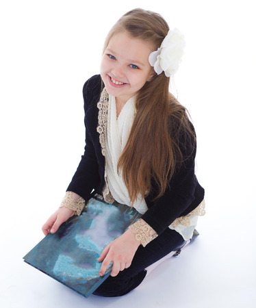 girl, book, music and education- girl with book. isolated on white background.の写真素材