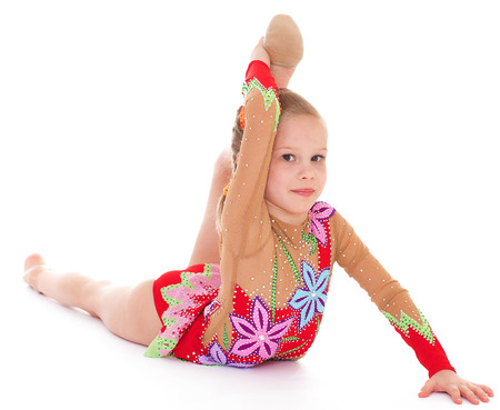 Adorable little gymnast.Isolated on white background.の写真素材