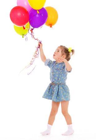 Charming girl with balloons.Isolated on white.の写真素材