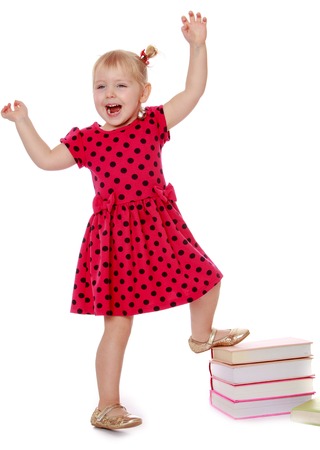 Joyful girl raised her hands up- isolated on white backgroundの写真素材
