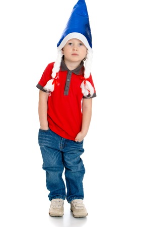 Funny little boy In red shirt and blue jeans in the hood Santa Claus.-Isolated on white backgroundの写真素材