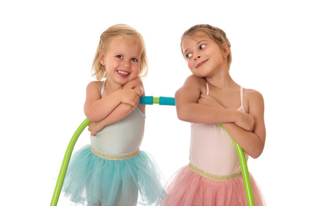 Little ballerinas looking at each other-Isolated on white backgroundの写真素材