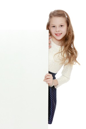 The little girl hid behind the banner.の写真素材