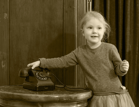 The girls ringing on the old phone.