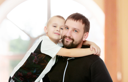 Dad and son hug.の写真素材