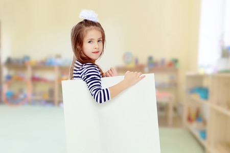 Little girl in a striped dress.
