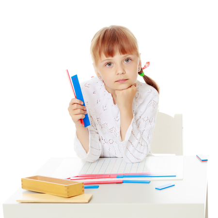 A little girl is studying Montessori stuff.の写真素材