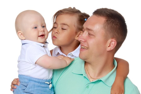 Happy dad with young children.の写真素材
