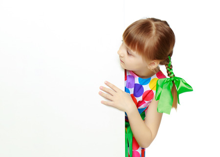 Girls looks because of the white obstacle.の写真素材