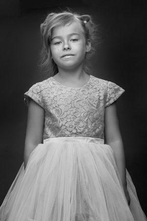 Little girl on a black backgroundの写真素材