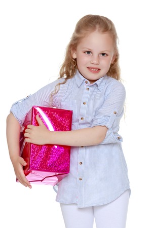 Little girl with a giftの写真素材