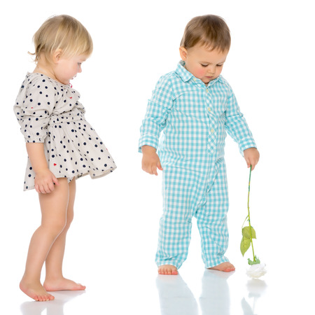 Babies boys and a girl cute embrace.の写真素材