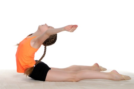 The gymnast performs an acrobatic element on the floor.の写真素材