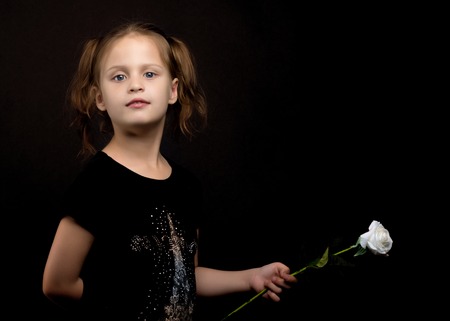 Little girl with a flower in her hand.の写真素材